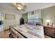 Relaxing bedroom with a queen bed and access to the bathroom at 27131 Ann Arbor Ave, Punta Gorda, FL 33983