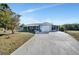 House exterior with driveway and landscaping at 27131 Ann Arbor Ave, Punta Gorda, FL 33983