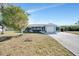 Single-story home with a carport and a well-maintained lawn at 27131 Ann Arbor Ave, Punta Gorda, FL 33983