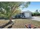 House exterior showcasing front yard and landscaping at 27131 Ann Arbor Ave, Punta Gorda, FL 33983