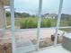 Screened patio overlooks a spacious backyard at 273 Mark Twain Ln, Rotonda West, FL 33947