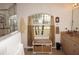 Bathroom with double vanity, large mirror, and window at 273 Mark Twain Ln, Rotonda West, FL 33947