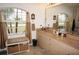 Bathroom with double vanity, large mirror, and window at 273 Mark Twain Ln, Rotonda West, FL 33947