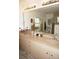 Double vanity bathroom with large mirror and window at 273 Mark Twain Ln, Rotonda West, FL 33947