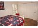 Guest bedroom with double doors and hardwood floors at 273 Mark Twain Ln, Rotonda West, FL 33947