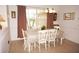 Bright dining room with a table, chairs, and window view at 273 Mark Twain Ln, Rotonda West, FL 33947