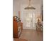 Front entry with decorative door and hardwood floors at 273 Mark Twain Ln, Rotonda West, FL 33947