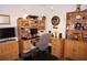 Spacious home office with wood desk and ample storage at 273 Mark Twain Ln, Rotonda West, FL 33947