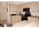 Well-equipped kitchen with ample cabinetry and counter space at 273 Mark Twain Ln, Rotonda West, FL 33947