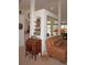 Living room with a built-in display shelf and mirror at 273 Mark Twain Ln, Rotonda West, FL 33947