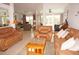Spacious living room with leather sofas and a coffee table at 273 Mark Twain Ln, Rotonda West, FL 33947