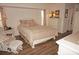 Main bedroom with a queen-size bed and sliding door access to the patio at 273 Mark Twain Ln, Rotonda West, FL 33947