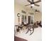 Relaxing patio with wicker furniture and ceiling fan at 273 Mark Twain Ln, Rotonda West, FL 33947