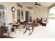 Relaxing patio with wicker furniture and ceiling fan at 273 Mark Twain Ln, Rotonda West, FL 33947