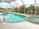 Inviting screened pool and spa at 273 Mark Twain Ln, Rotonda West, FL 33947