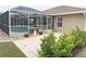 Enjoy the screened pool and adjacent patio area at 273 Mark Twain Ln, Rotonda West, FL 33947