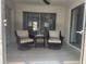 Relaxing enclosed patio with tiled floor and seating at 2801 Magdalina Dr # 1A, Punta Gorda, FL 33950