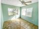 Spacious bedroom with light walls, ceiling fan, and tile flooring at 30105 Oak Rd, Punta Gorda, FL 33982