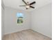 Bedroom with ceiling fan, window, and double door closet at 3083 Gideon St, North Port, FL 34288