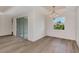 Bright dining room with sliding glass doors and hardwood floors at 3083 Gideon St, North Port, FL 34288