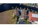 Aerial view of townhouses, pool, and canal access at 3335 Purple Martin Dr # 6, Punta Gorda, FL 33950