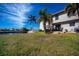 Large backyard with canal views and lush green grass at 3335 Purple Martin Dr # 6, Punta Gorda, FL 33950