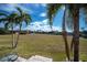 Spacious backyard with canal view and palm trees at 3335 Purple Martin Dr # 6, Punta Gorda, FL 33950