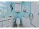 Bathroom with light blue walls and white cabinets at 3335 Purple Martin Dr # 6, Punta Gorda, FL 33950
