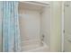 Clean bathroom with a bathtub and light blue shower curtain at 3335 Purple Martin Dr # 6, Punta Gorda, FL 33950