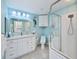 Updated bathroom with white cabinets and a walk-in shower at 3335 Purple Martin Dr # 6, Punta Gorda, FL 33950