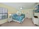 Bedroom with white wicker furniture and blue bedding at 3335 Purple Martin Dr # 6, Punta Gorda, FL 33950