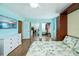 Bedroom with wood floors, built-in cabinets, and a wall mural at 3335 Purple Martin Dr # 6, Punta Gorda, FL 33950