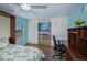 Bedroom with a desk, wood floors, and ample closet space at 3335 Purple Martin Dr # 6, Punta Gorda, FL 33950