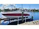 Private boat lift with boat in place at waterfront property at 3335 Purple Martin Dr # 6, Punta Gorda, FL 33950