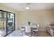 Bright dining area with glass table and chairs, view of canal at 3335 Purple Martin Dr # 6, Punta Gorda, FL 33950