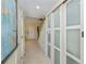 Clean hallway with tile floor and built-in storage at 3335 Purple Martin Dr # 6, Punta Gorda, FL 33950