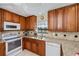 Kitchen features granite countertops, wood cabinets, and modern appliances at 3335 Purple Martin Dr # 6, Punta Gorda, FL 33950