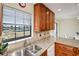 Kitchen features granite countertops, double sink, and wood cabinets at 3335 Purple Martin Dr # 6, Punta Gorda, FL 33950