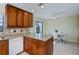 Modern kitchen with granite island, wood cabinets, and breakfast nook at 3335 Purple Martin Dr # 6, Punta Gorda, FL 33950