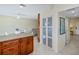 Kitchen island with granite countertop and wooden cabinets at 3335 Purple Martin Dr # 6, Punta Gorda, FL 33950