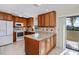 Updated kitchen with granite countertops, island, and breakfast bar at 3335 Purple Martin Dr # 6, Punta Gorda, FL 33950