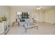 Bright living room features tiled floors, sofa, and large windows at 3335 Purple Martin Dr # 6, Punta Gorda, FL 33950