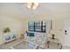 Living room boasts water views, comfy seating, and a ceiling fan at 3335 Purple Martin Dr # 6, Punta Gorda, FL 33950