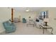 Spacious living room with ample seating, and a view to the kitchen at 3335 Purple Martin Dr # 6, Punta Gorda, FL 33950