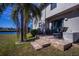 Back patio with seating area overlooking the canal at 3335 Purple Martin Dr # 6, Punta Gorda, FL 33950