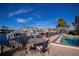 Community pool area with table and chairs overlooking the canal at 3335 Purple Martin Dr # 6, Punta Gorda, FL 33950