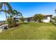 Single story home with a canal-front location and lush landscaping at 343 Portofino Dr, Punta Gorda, FL 33950