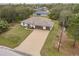 Single-story home with a three-car garage and spacious driveway at 3495 Levee St, North Port, FL 34288