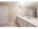 Double vanity bathroom with white cabinets and quartz countertop at 3495 Levee St, North Port, FL 34288