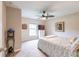 Bedroom with ceiling fan, TV, and globe decor at 3495 Levee St, North Port, FL 34288